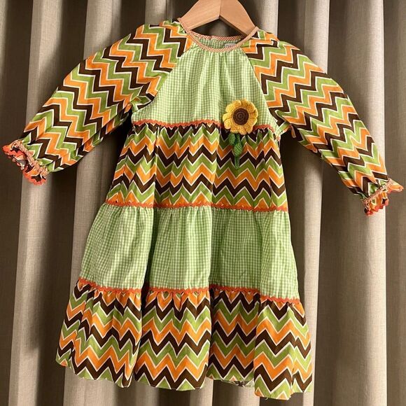 Petit Ami - 2T - Toddler Girl’s Chevron Patterned Dress with Flower Accent - Picture 1 of 5